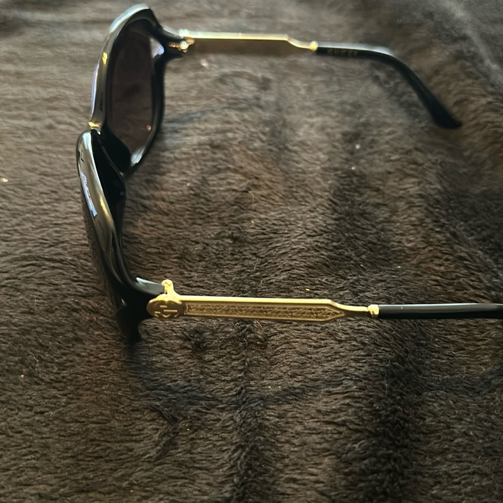 Gucci, Grady, and black and gold sunglasses